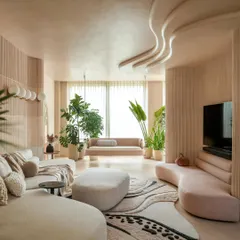 This living room is the heart of our "House of Mousse" project. We designed the space to feel like a soft cocoon, using flowing curves in the ceiling and furniture to create a sense of continuity and calm. The earthy, mousse-inspired color palette and lush greenery transform the interior into a living, breathing sanctuary.