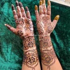 This design is a gorgeous fusion of styles, with bold, dark-filled roses on one arm and more delicate, shaded florals on the other, creating a unique and asymmetrical look.