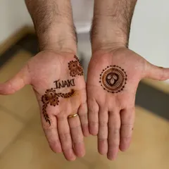 A simple and personal design for a male guest, featuring his name and a small motif. It was his first time getting henna and he loved it.