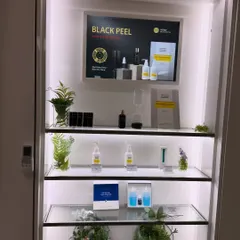 At Theraderm, I attended a workshop to dive deep into the science behind their new peels, including the Black Peel for acne and oily skin. This display showcases their product line.