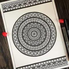 This full-page A4 mandala with patterned borders is a testament to patience. The dense, repeating patterns create a powerful visual rhythm that draws you into the center.