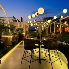 My love for biophilic design is evident in these custom tree-like light sculptures at Tipsy Town. They are not just light fixtures but artistic installations that merge technology with nature.