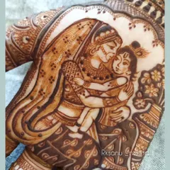 A close-up of a beautiful baby shower design depicting the divine love of Yashoda and baby Krishna. This is a popular and meaningful theme for mothers-to-be, symbolizing unconditional love and protection.