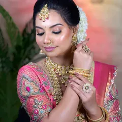 This pose highlights the beautiful hand jewellery and bangles that are essential to a complete South Indian bridal look.