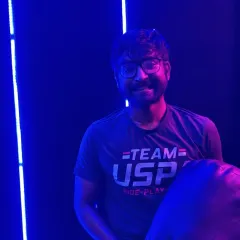 A happy member at our spin studio, Ride Republic. The neon lights and high-energy music make for an immersive cardio experience.