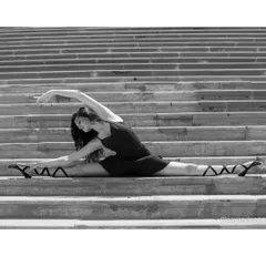 A center split on a staircase, showcasing the flexibility and strength that comes from years of dedicated dance training. This discipline is part of every routine I teach.