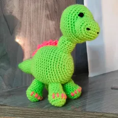 A cute green dinosaur I customized for an order. I can make dinosaurs and other animals in any color you like.