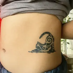 Here’s a healed shot of a custom cat tattoo done in my signature 'Masala Flow' style. You can see the bold, curvy, tribal-inspired linework that gives it a unique, flowing energy on the client's side. This is a great example of my desi-style tattoo art.