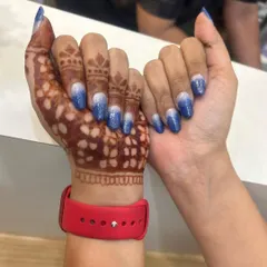 This client wanted something special to go with her henna. I created this sparkling blue and silver ombre design on her natural nails, which beautifully complements the intricate mehndi art.