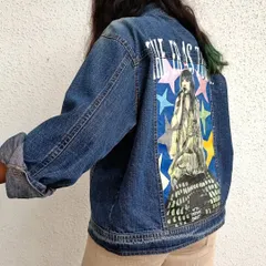 For all the Swifties, this is a hand-painted denim jacket celebrating Taylor Swift's Eras Tour. The design features a portrait of Taylor against a backdrop of colorful stars, capturing the energy of her iconic tour. This piece is a perfect way to show your love for her music.