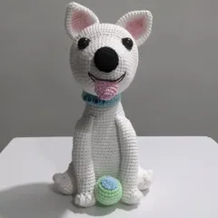 A custom crochet portrait of a beloved pet dog named Toby. I captured his happy expression, floppy tongue, and even included his favorite little ball to make this handmade plushie extra special.