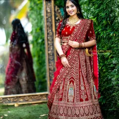 For a timeless and regal look, my red velvet lehenga is a top choice. It features intricate, heavy embroidery that looks luxurious on camera, and the rich velvet fabric adds depth and elegance. This is perfect for creating classic, heritage-themed pre-wedding portraits.