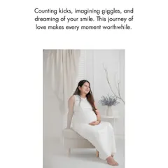 A serene and classic maternity portrait. The mother-to-be, dressed in all white, radiates a peaceful glow, perfectly capturing the quiet dreams and happy anticipation of pregnancy.