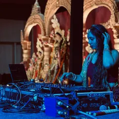 I fully immerse myself in the theme of an event. Here I am, dressed in traditional attire and lost in the music during a beautiful Durga Puja Dandiya night.