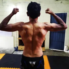 A strong back is essential for grappling and overall power. This is the result of consistent strength and conditioning work.