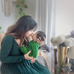 The story continues. Here, a new mother shares a tender nose-to-nose moment with her two-month-old baby in my cozy boho studio, capturing the incredible bond that has already formed.