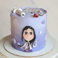 A personalized cake for a doctor. The design features a cute, hand-drawn caricature of the doctor, a stethoscope, and other medical-themed fondant details on a purple ombre cake.
