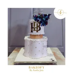 This was a massive 10kg truffle cake for a reception ceremony. The bottom tier has a unique scallop shape, and the whole cake is adorned with beautiful orchids. I take so much pride in crafting these large cakes for your special occasions.