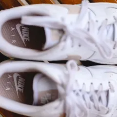The bride's shoes. A top down shot of Disha's cool white Nike Air sneakers, a fun and unconventional choice that perfectly reflected her style.