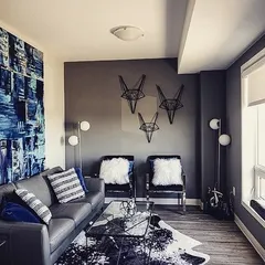 This living room features a large abstract blue and white canvas we created. The piece anchors the room's color scheme and adds a layer of texture and sophistication.