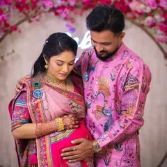This is another tender moment from the same baby shower. It shows how the coordinated pink outfits create a harmonious and picture-perfect look for celebrating a new beginning.