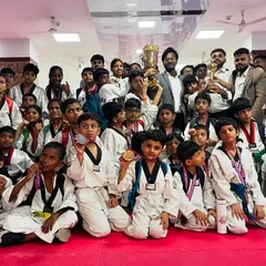 The whole team celebrating with their trophies and medals. The joy of victory is best when shared with your teammates who trained alongside you.