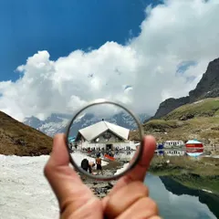 A unique view of Hemkund Sahib, where the serene gurudwara reflects in the holy sarovar. This high-altitude Sikh pilgrimage site is a journey of faith and immense natural beauty.