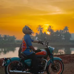 Capturing the sunset in Goa with the Royal Enfield. This photo uses the warm, golden light to create a cinematic feel, emphasizing the experience of riding and the freedom of the open road.