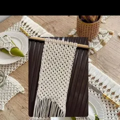 This image shows a complete macrame dining set, including table mats, a runner, and napkin rings. I can create custom sets for your dining table to give it a cohesive, bohemian look.