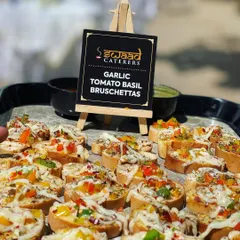 Garlic Tomato Basil Bruschettas are a perfect example of my fusion menu. These bite-sized toasts are topped with fresh ingredients and are a stylish and light starter for any party.