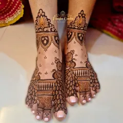 A unique design where the peacock's flowing tail feathers create the pattern across the foot.