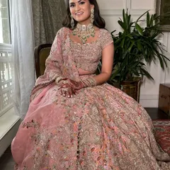 A full-length view of this delicate and fresh sister of the bride look. The makeup was designed to complement her intricately embroidered lehenga, creating a harmonious and picture-perfect result.