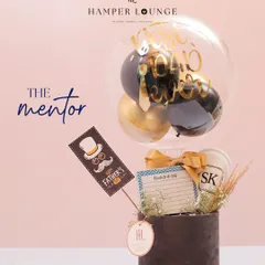 For the dad who is a mentor, this sophisticated Father's Day hamper includes a personalized journal and other thoughtful items, topped with a stylish balloon.