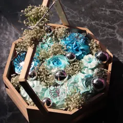 Another view of the blue cupcake hamper, showing how the baby's breath flowers fill the gaps and complete the look.