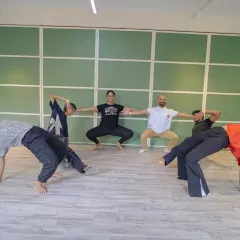 A fun, creative pose from our Launch Weekend. Even in our most energetic sessions, there's always room for playfulness and connection. Our studio is a place to learn and have fun.