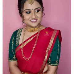 A beautiful profile of Varshini's engagement makeup. This angle highlights the flawless base, the gentle contouring, and the elegant updo that completes her traditional South Indian look.