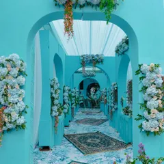 An immersive entrance for a Dior-themed Mehendi. Guests walk through a stunning passageway of Tiffany blue arches adorned with cascading blue and white hydrangeas, setting a tone of pure elegance.