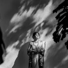 When a bride is ready ahead of schedule, it gives us time to play with light and shadow. This portrait of Srushti at the Turf Club is one of my favorites. I used the natural shadows from the leaves to create this dramatic, artistic black and white bridal shot that feels both timeless and modern.
