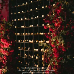 Lighting is storytelling. Here, a towering wall of over a thousand candles created a backdrop of intimate, flickering warmth. It’s a simple concept with a powerful impact, designed to evoke a sense of timeless romance and pure magic.