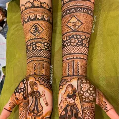 I love bringing a couple's story to life. This full bridal mehendi features custom portraits of the bride and groom, along with religious symbols like the Ganesha, making it deeply personal and unique to their wedding.