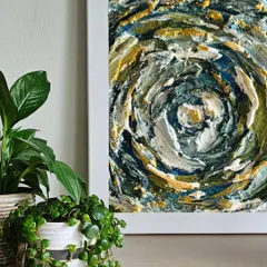 A close-up of a textured abstract piece, where layers of color and paste create a sense of depth and movement. This is a popular style in our workshops.
