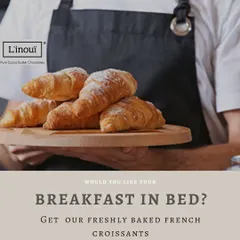 Here is one of our bakers presenting a freshly baked batch. We believe in the craft of baking, and holding a tray of warm, fragrant croissants is one of the simple joys of our day.
