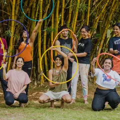 A happy group shot from an outdoor hoop flow session. We provide all the props, so you just need to show up and be ready to play and connect with some cool people.