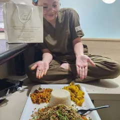 A happy customer enjoying a platter of my snacks. Your satisfaction is my biggest reward.