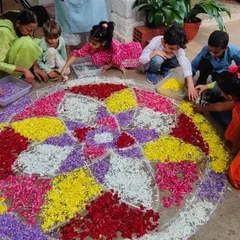 Children of all ages work together to create a beautiful pookolam (flower rangoli) for our Diwali celebration. This collaborative art project fills our space with color, fragrance, and festive spirit.