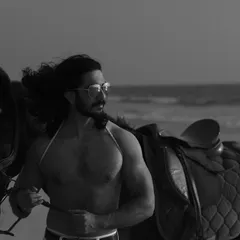 An extensive editorial series of a male model with a horse on the beach. I used a mix of color and black and white, along with varied poses, to create a powerful narrative of untamed strength and freedom.