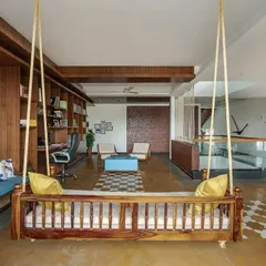 This multi-functional library and relaxation space was designed for a family of doctors to unwind. The traditional wooden swing, open shelving, and informal seating create a comfortable, personal area that is both practical and full of character.