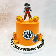 Power up your celebration with this Dragon Ball Z cake, featuring Goku, the iconic kanji symbol, and edible Dragon Balls.
