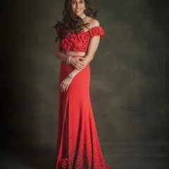 For a truly breathtaking moment, this red Maison Valentino gown is everything. The off-shoulder neckline with rose detailing and the sparkling gradient on the skirt is the definition of elegance and comfort for any high-profile event.