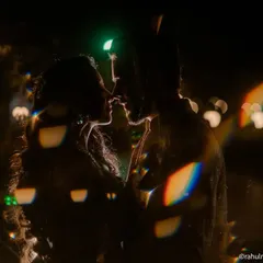 Night shoots allow for so much creativity. Using backlighting and a prism effect, I created this silhouette of the couple against the bokeh of city lights. It’s a dramatic and artistic way to tell a love story after dark.